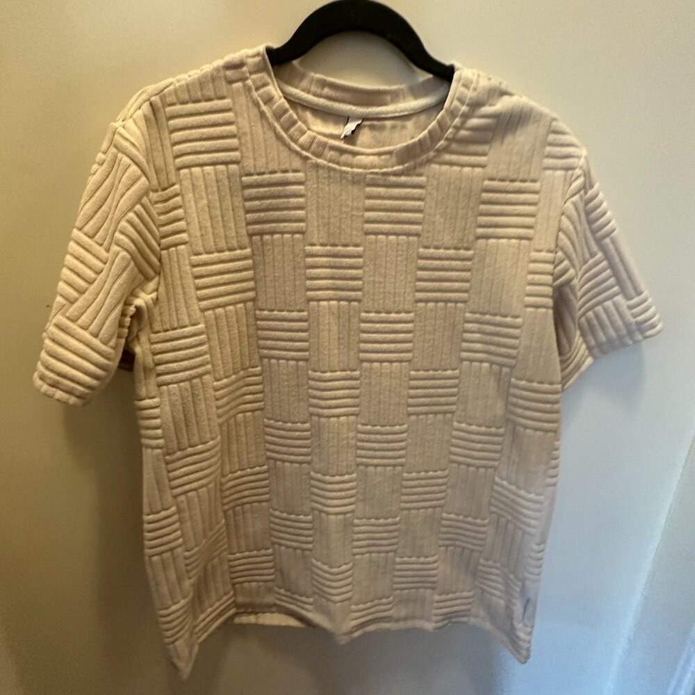 Minimalist textured short-sleeve top in beige, size L. Modern boxy fit, soft fab